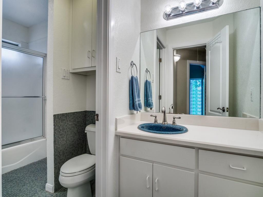 1014 Amanda Drive Mansfield, TX 76063 - Photo 33 of 40 a bathroom with a granite countertop toilet sink and mirror