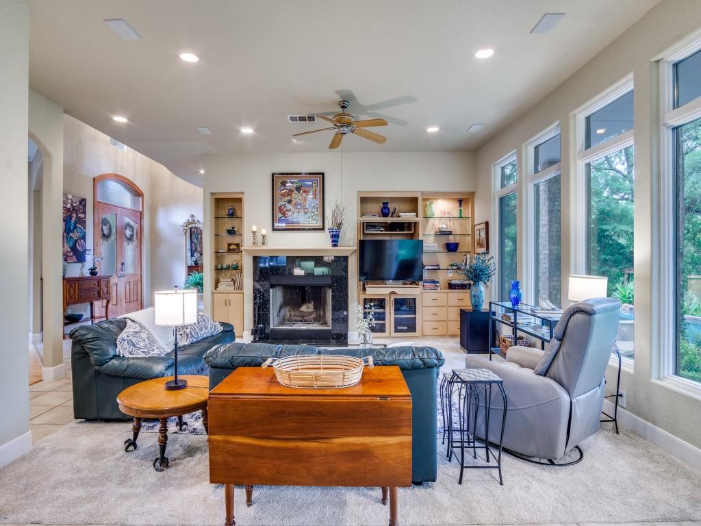 1014 Amanda Drive Mansfield, TX 76063 - Photo 36 of 40 a living room with fireplace furniture and a large window