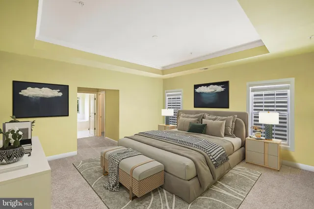 a bedroom with a bed and a television