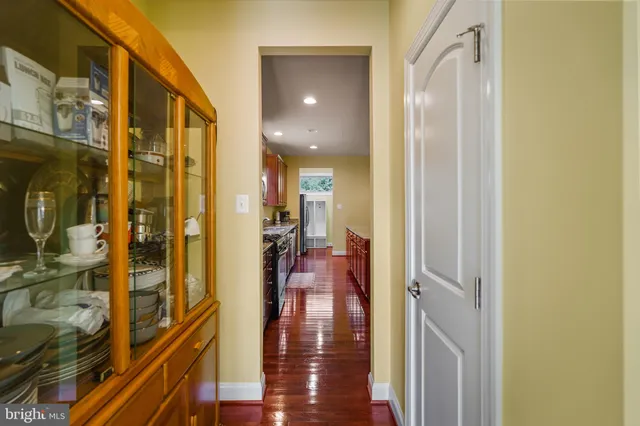 a view of walk in closet with clothes