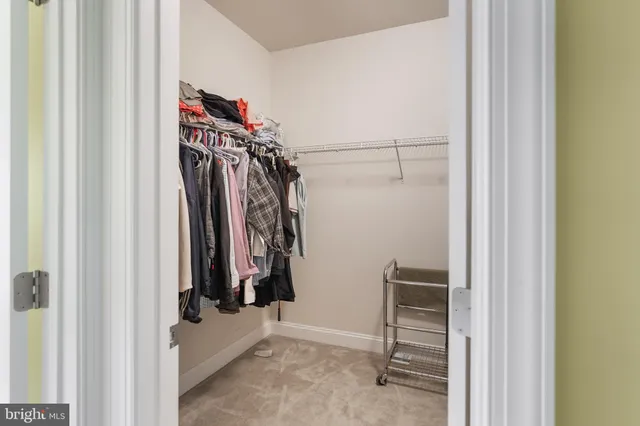 a bathroom with a tub shower sink and mirror