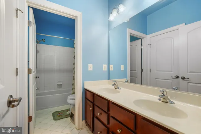 a bathroom with a shower and a toilet