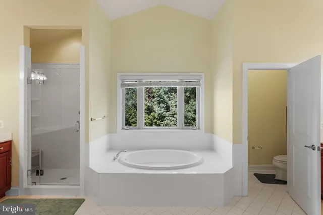 a view of storage and utility room with washer and dryer