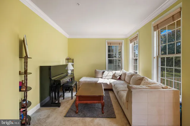 a bed room with furniture and a window