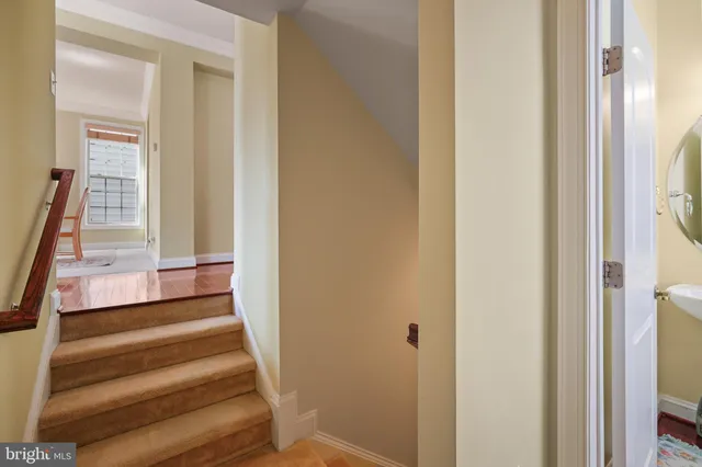 a bathroom with a shower curtain and a sink