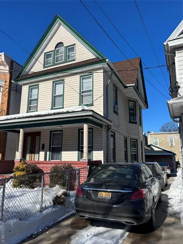 a car parked in front of a house