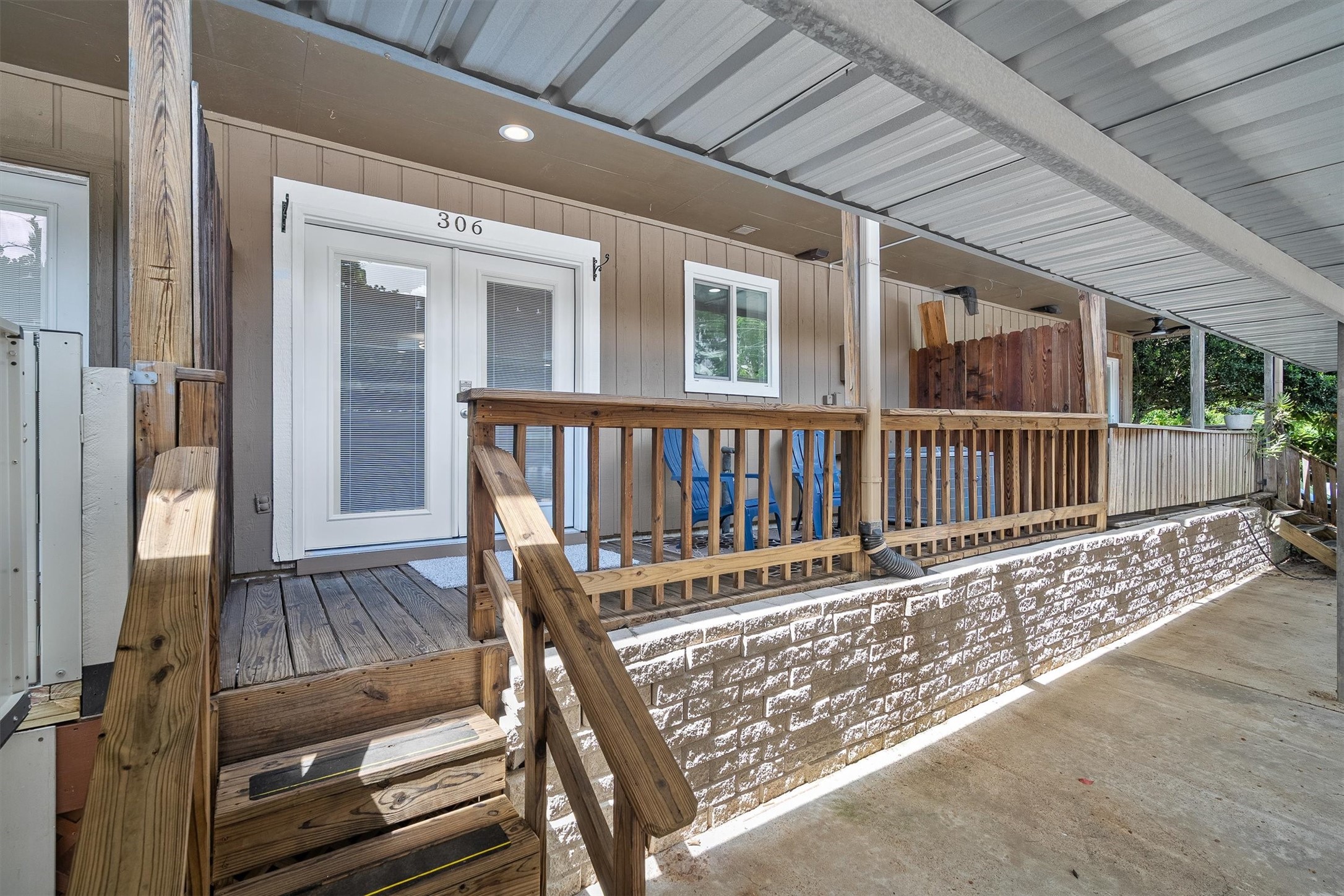 1011 Hamblen Road, Unit 306 Houston, TX 77339 - Photo 24 of 38 Out back, the covered deck offers a shady retreat, an easy spot for morning coffee or unwinding after a long day.