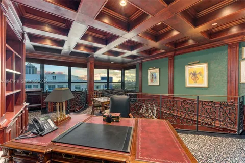 a view of game room with window and wooden floor