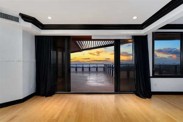 a room with furniture and a flat screen tv