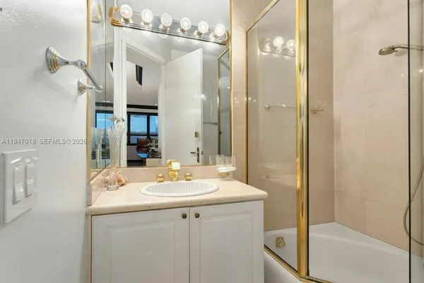 a utility room with sink dryer and washer