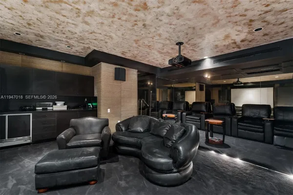 a large bed sitting in a bedroom next to a large window