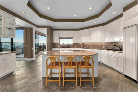 a kitchen with counter top space and appliances