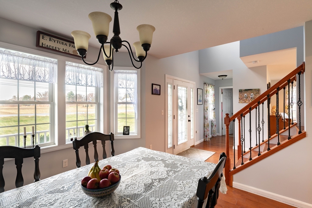 83 Bay Road Hadley, MA 01035 - Photo 11 of 36 a view of a dining room with furniture window and outside view