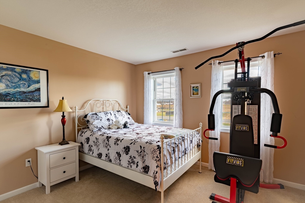 83 Bay Road Hadley, MA 01035 - Photo 21 of 36 a bedroom with a bed and window