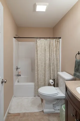 a bathroom with a toilet a sink and a bathtub