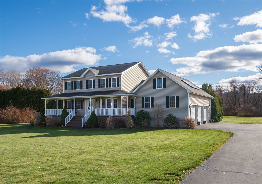 83 Bay Road Hadley, MA 01035 - Photo 24 of 36 a front view of a house with garden and trees