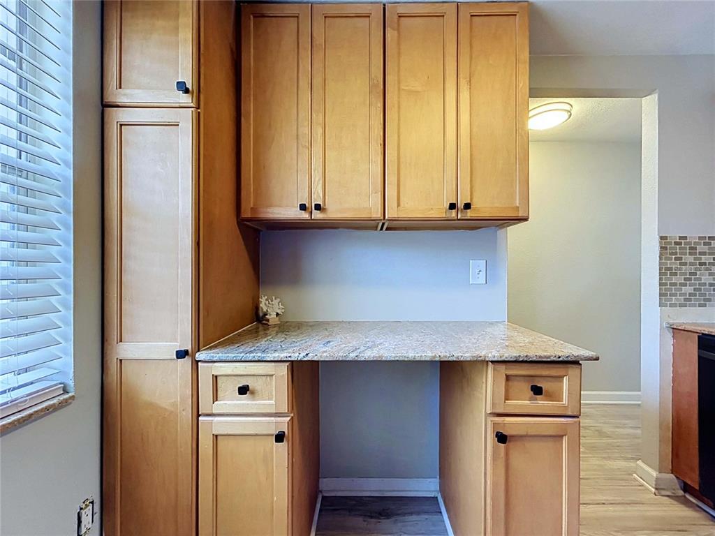 4227 Sheldon Place New Port Richey, FL 34652 - Photo 5 of 25 a view of cabinets with wooden floor