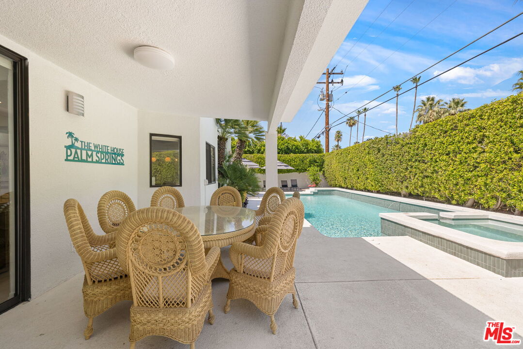 1414 Sagebrush Road Palm Springs, CA 92264 - Photo 11 of 48 a view of a dining room with furniture window and outside view