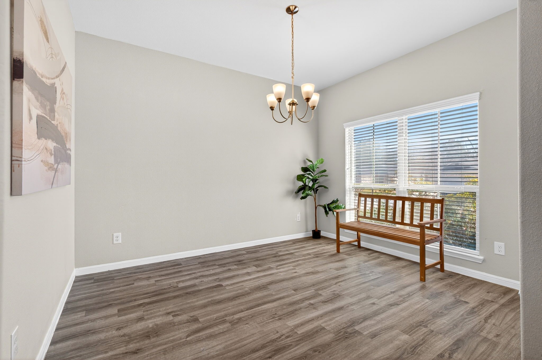 2121 Cedar Way Drive Conroe, TX 77301 - Photo 3 of 27 a view of a room with wooden floor and windows