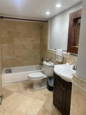 a bathroom with a sink a toilet and a bathtub