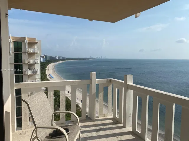 a view of balcony with wooden floor