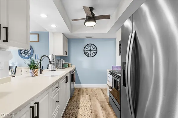 a spacious bathroom with a double vanity sink and a mirror
