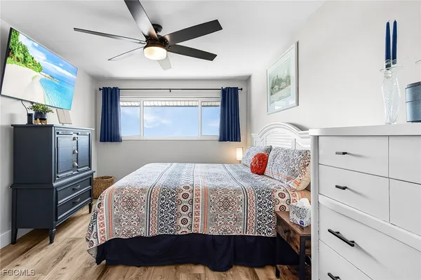a bedroom with a bed and a dresser