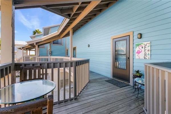 a view of a balcony and wooden floor