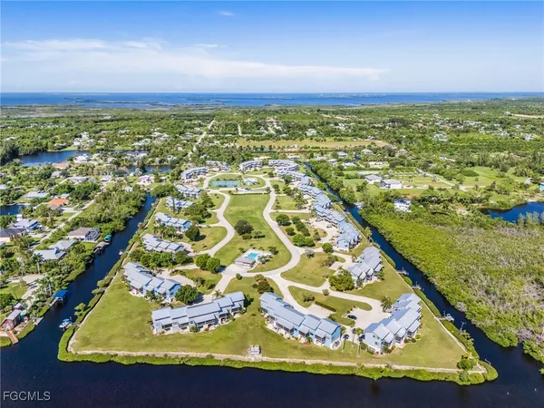 an aerial view of residential houses with outdoor space