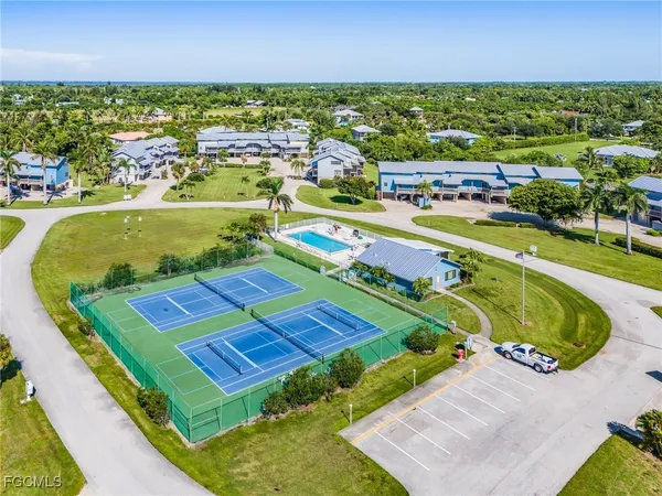 an aerial view of a pool yard and lake view