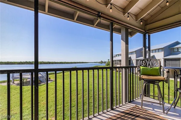 a view of a balcony with chairs