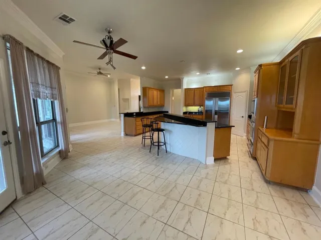 a kitchen with a cabinets and white appliances