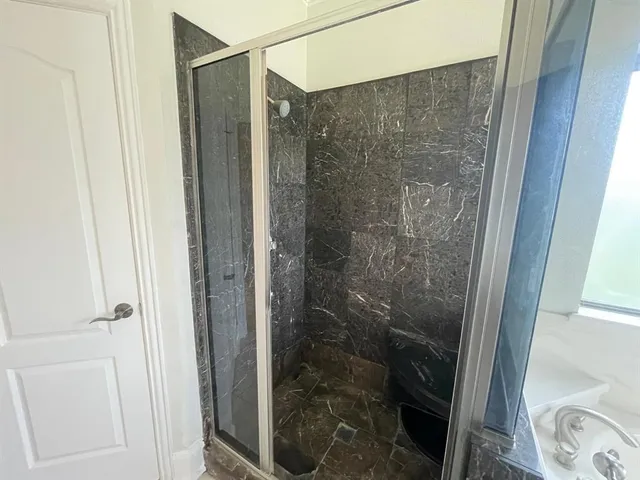 a bathroom with a bathtub and a sink