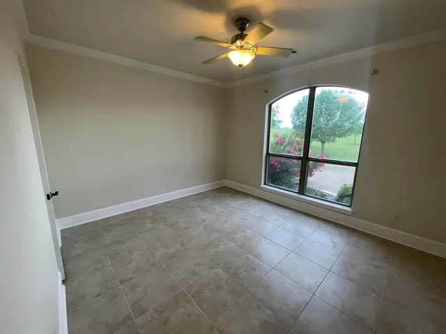 an empty room with a empty space and windows