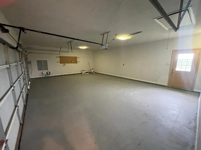 a front view of a house with a garden and yard