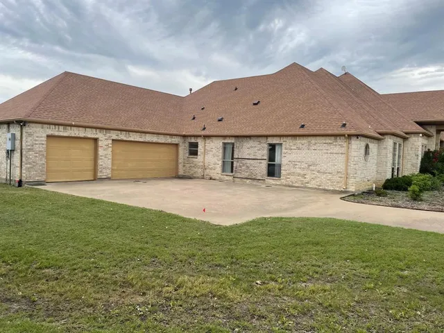 a garden with trees in the background