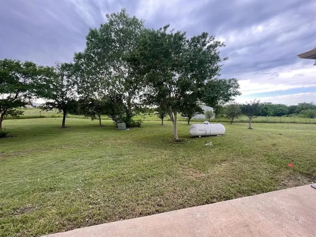 a view of a lake with a yard