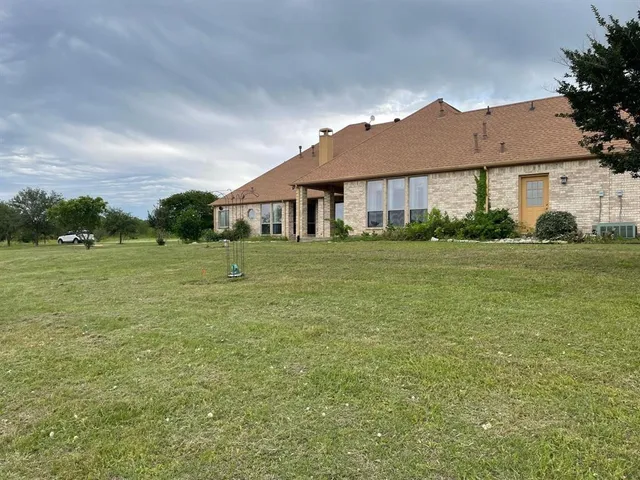 a view of a field with an ocean
