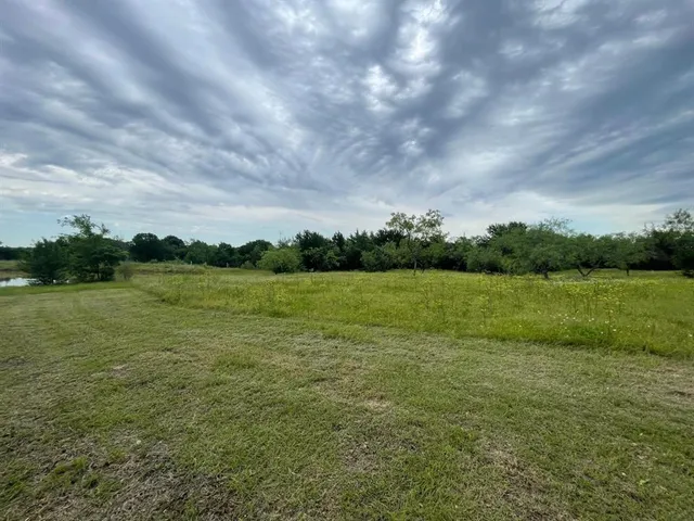 a view of a lake with a yard