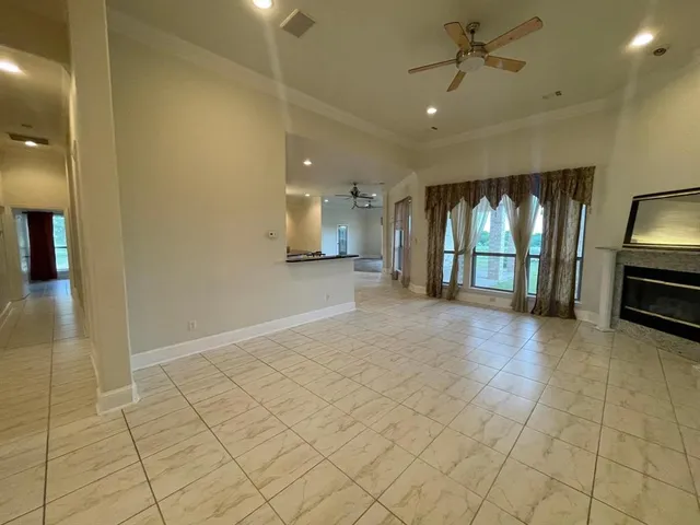 a kitchen with stainless steel appliances kitchen island granite countertop a sink a counter top space and cabinets