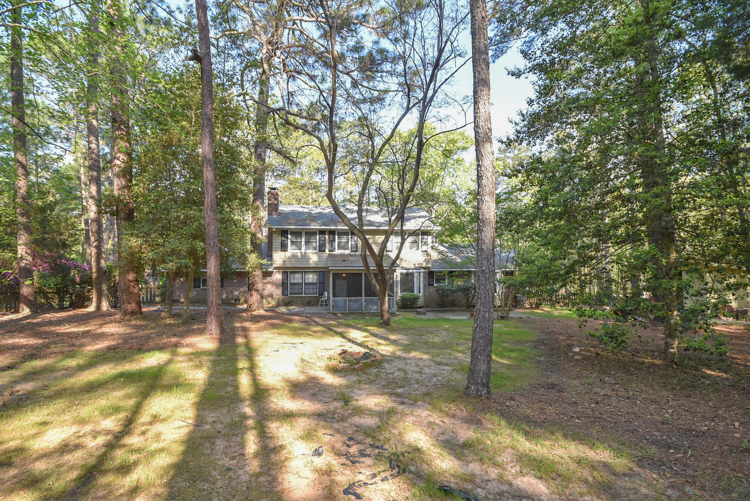 715 Barber Road Southern Pines, NC 28387 - Photo 4 of 17 Wooded and fenced backyard.