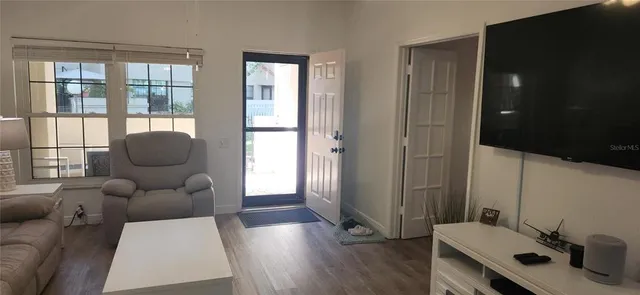 a living room with furniture and a large window