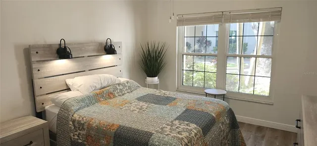 a bathroom with a sink a mirror and a shower