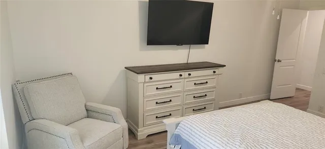 a bathroom with a shower and a sink