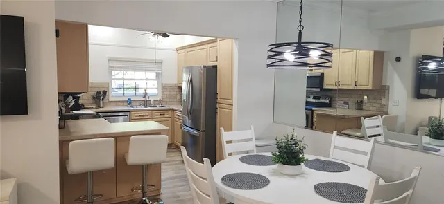 a view of swimming pool with a patio