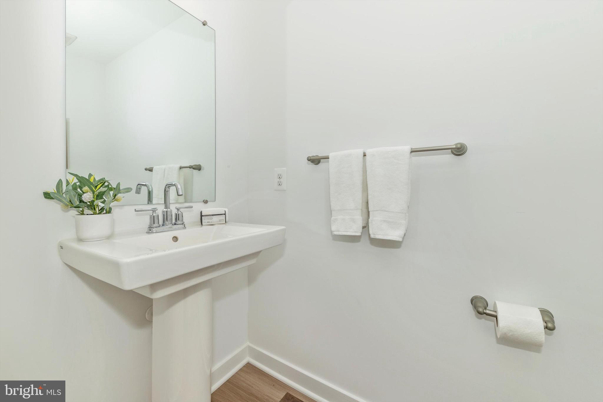 720 Iron Frg Road Frederick, MD 21702 - Photo 13 of 33 a bathroom with a sink a mirror and a shower