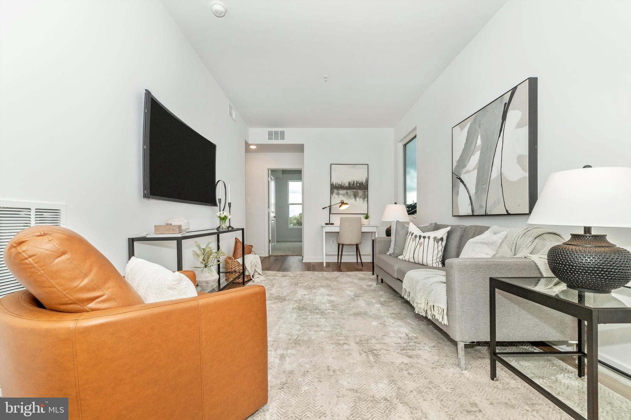 720 Iron Frg Road Frederick, MD 21702 - Photo 17 of 33 a living room with furniture and a flat screen tv