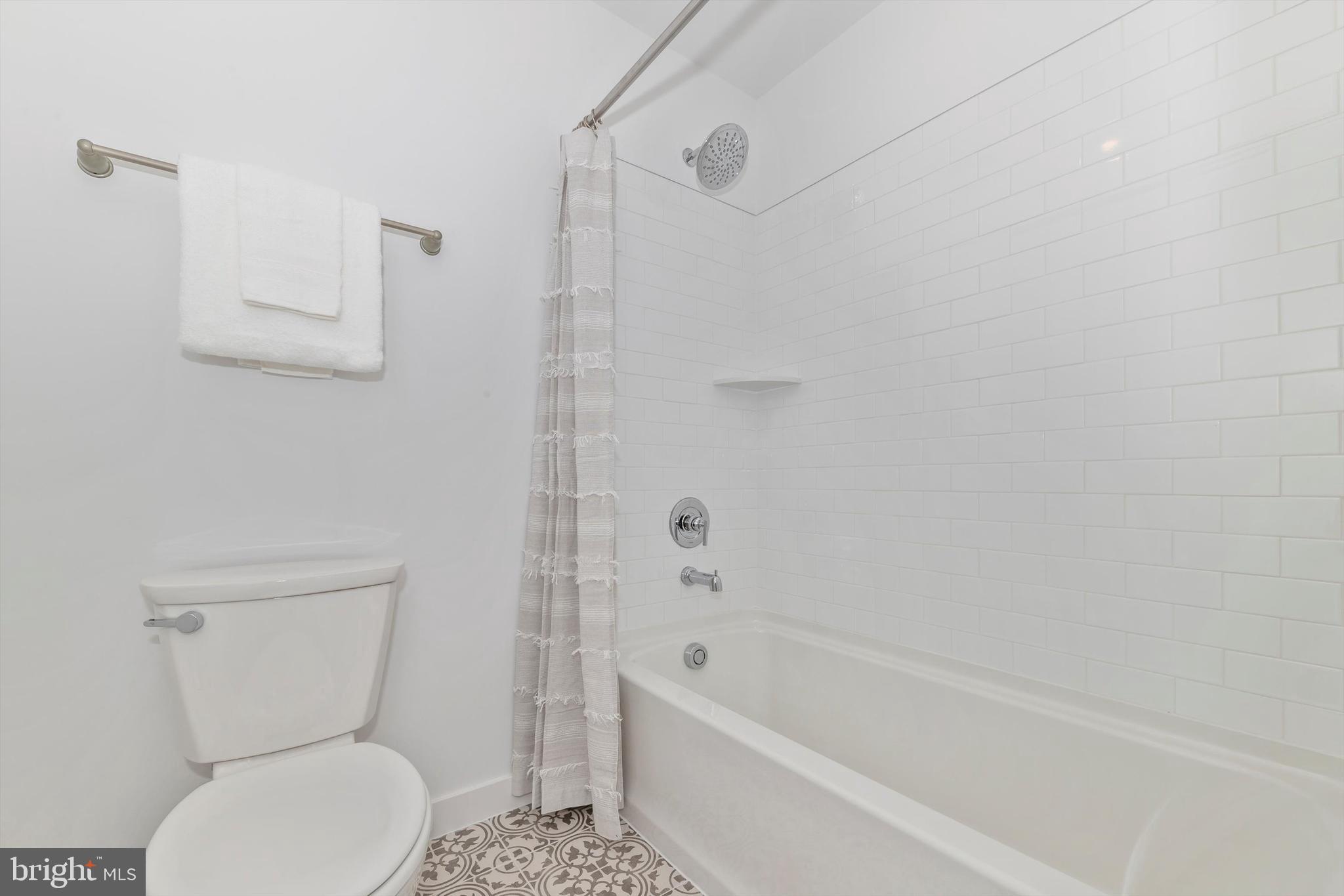 720 Iron Frg Road Frederick, MD 21702 - Photo 30 of 33 a bathroom with a toilet and a bathtub