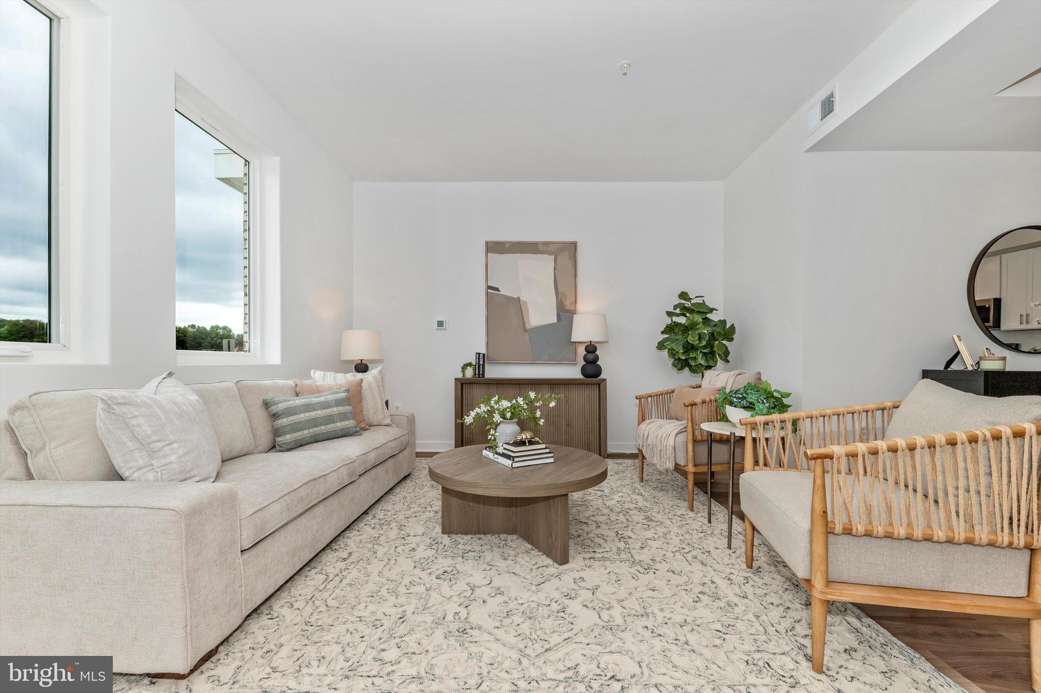 720 Iron Frg Road Frederick, MD 21702 - Photo 7 of 33 a living room with furniture a rug and a table