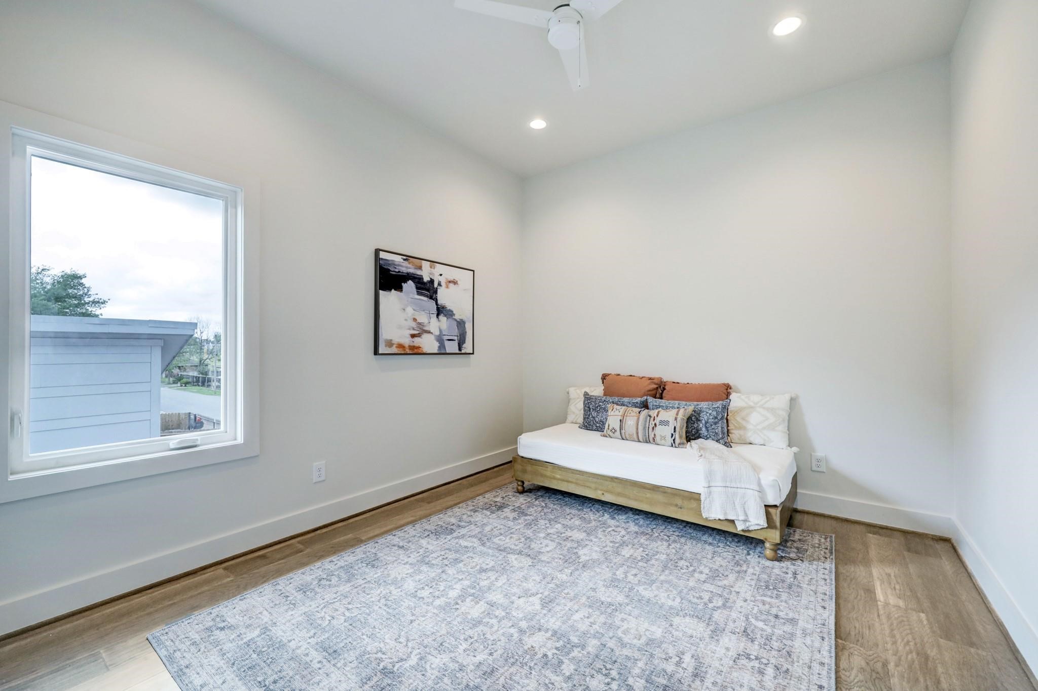 3827 Arlington Street Houston, TX 77018 - Photo 29 of 39 This cozy room with a large window allowing natural light, creating a bright and inviting space.